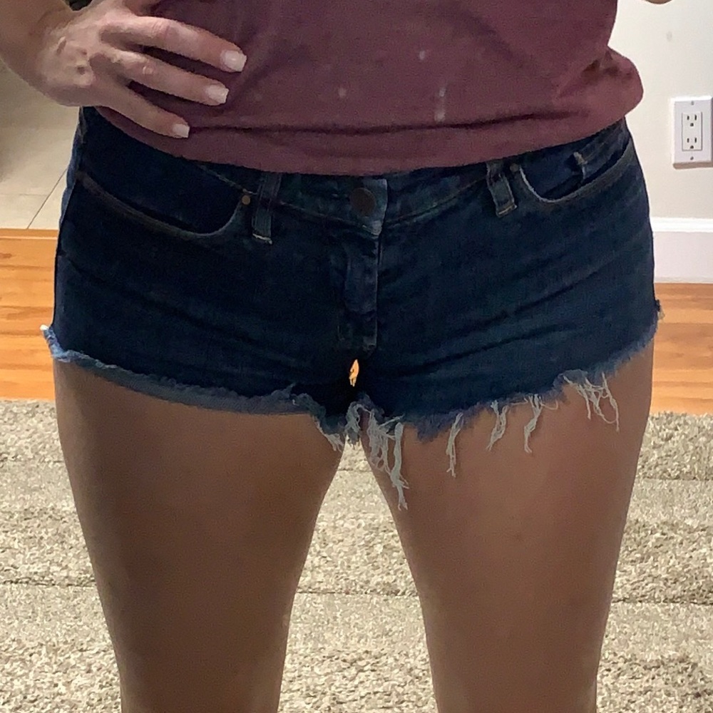 Dark blue denim, stretchy cut off jean shorts size 27